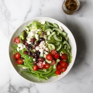 Greek salad in a white bowl