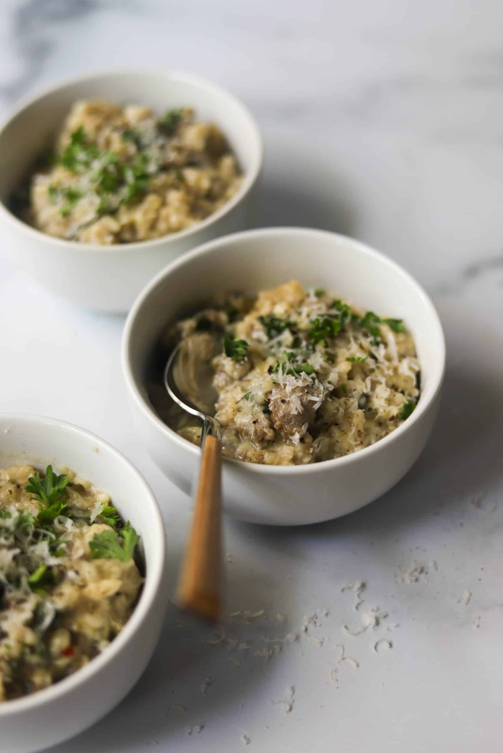 A side shot of bowls of risotto.