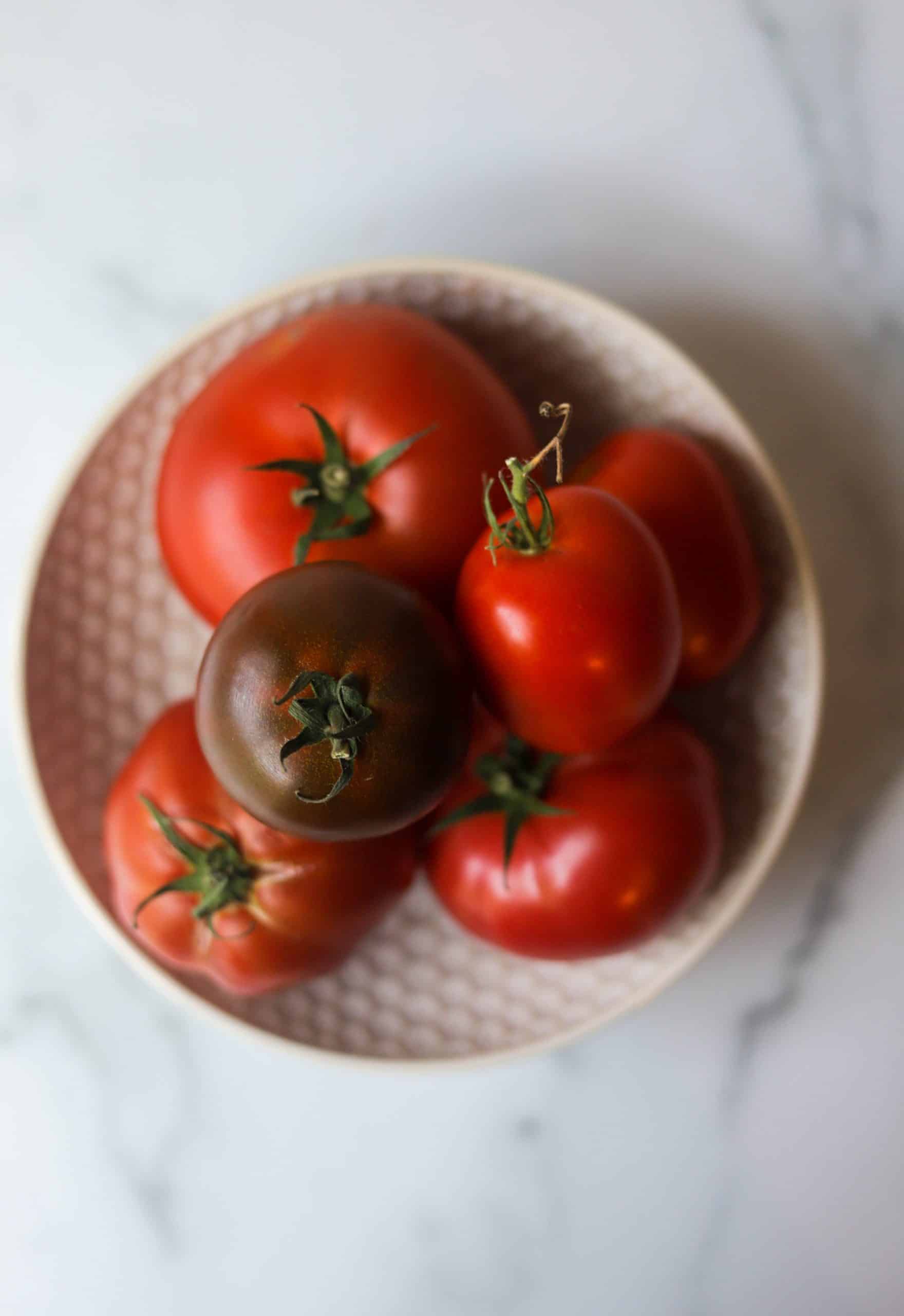 A bowl of heirloom tomatoes.