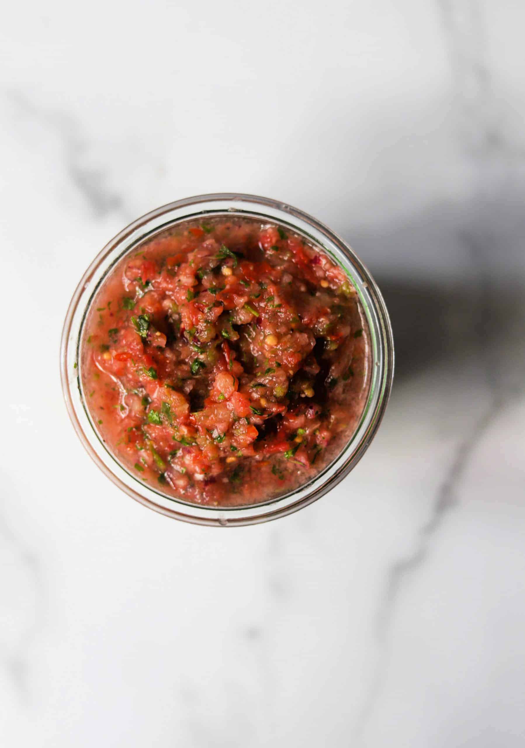 A birds eye view of tomato salsa.
