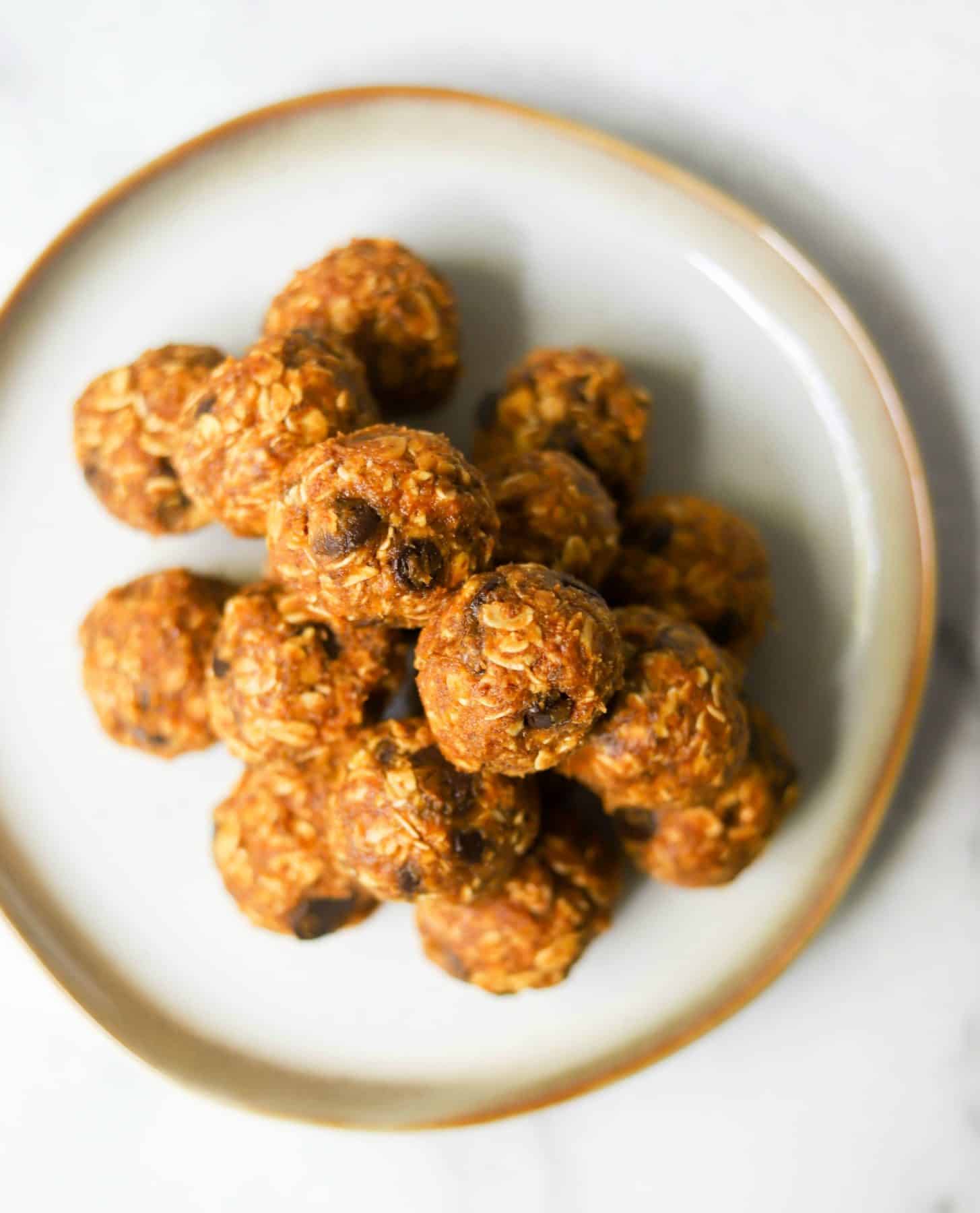 Pumpkin cookie dough bites on a white plate