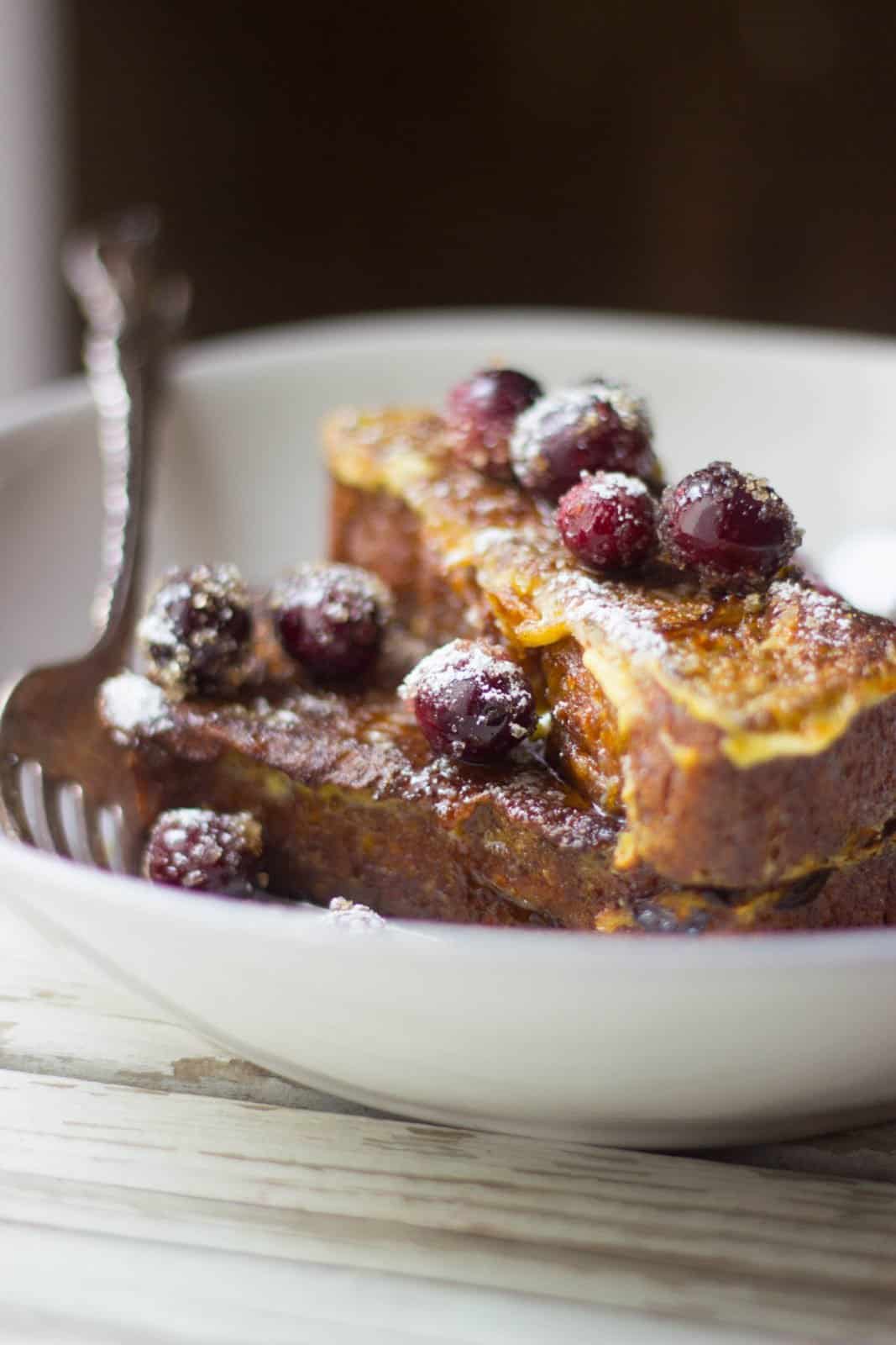 Close-up view of the french toast on a white plate. 