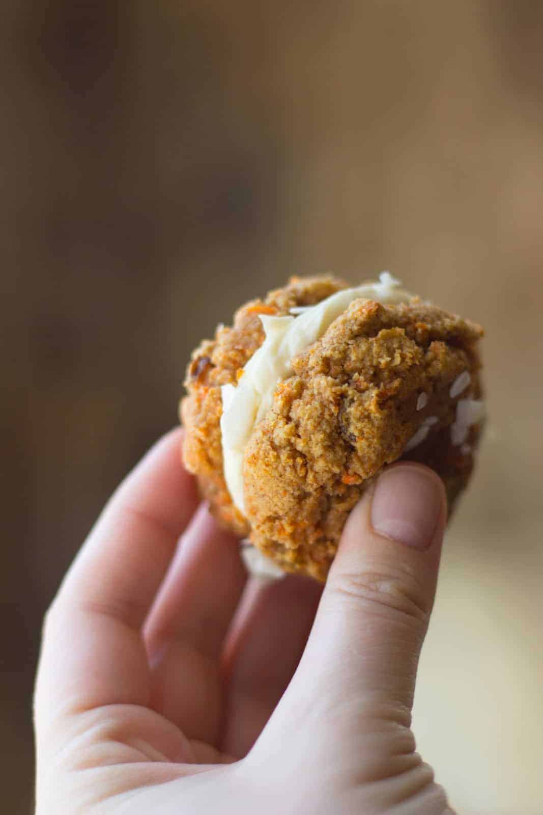 Carrot cake cookie sandwich in a hand