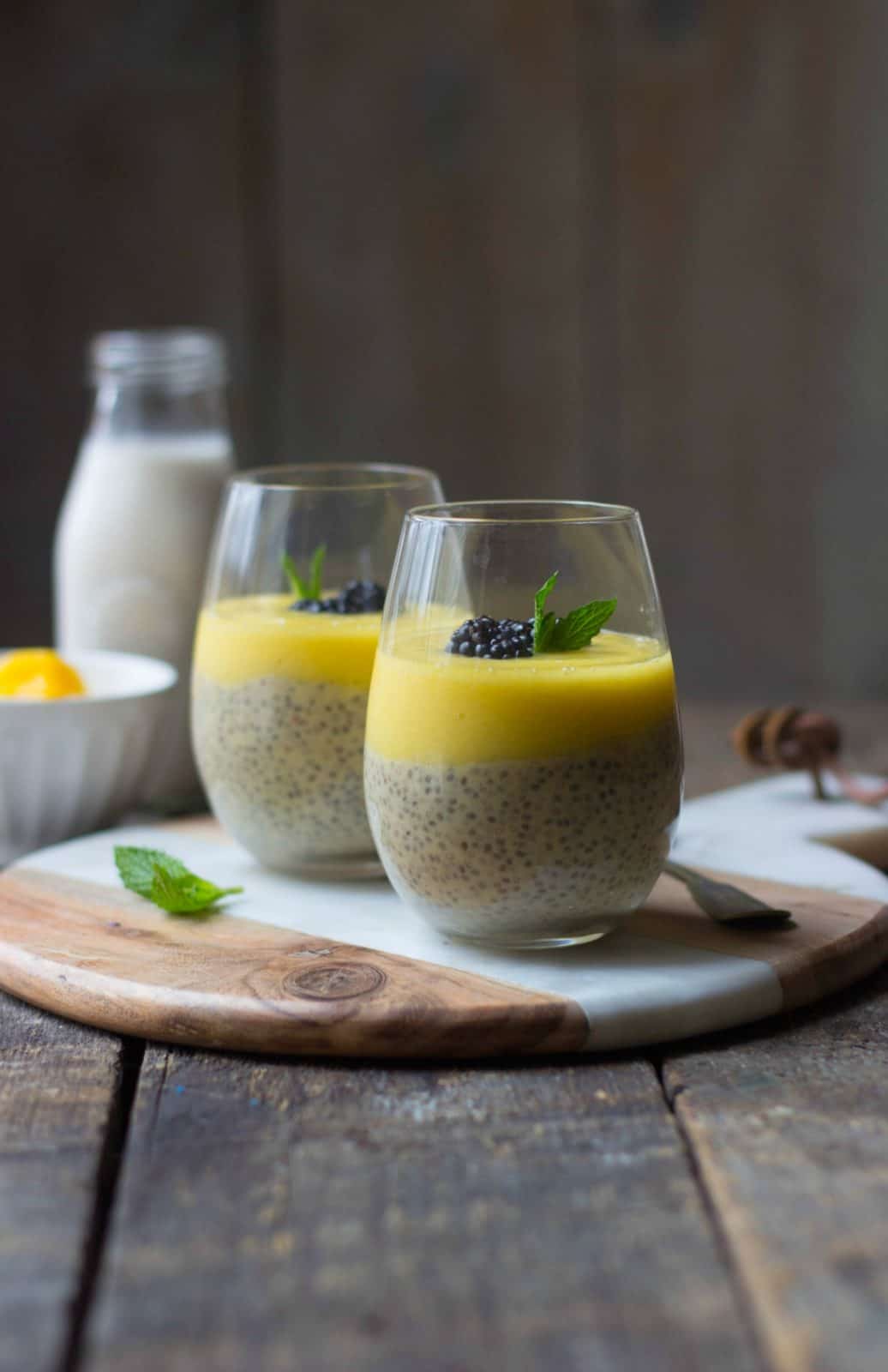 Mango chia seed parfaits in clear glasses