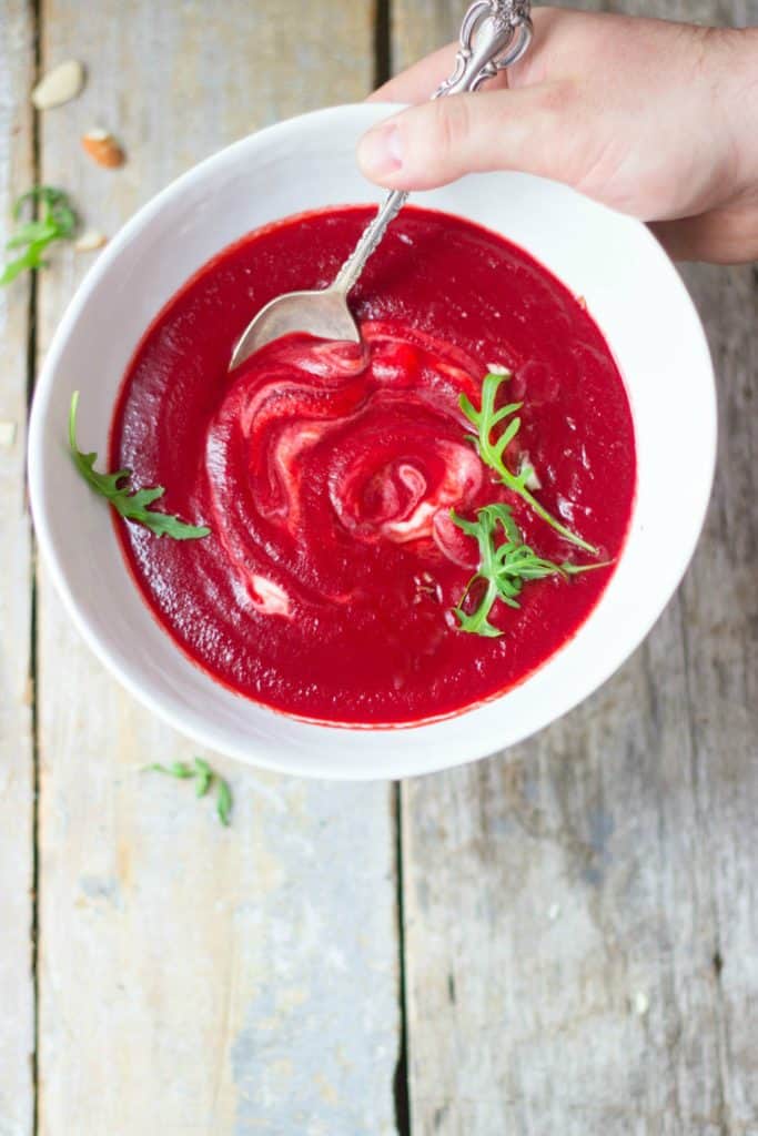 Beet soup in a white bowl