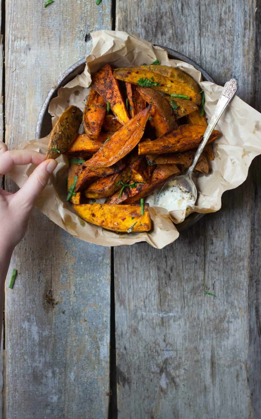 Roasted sweet potato wedges in a tin