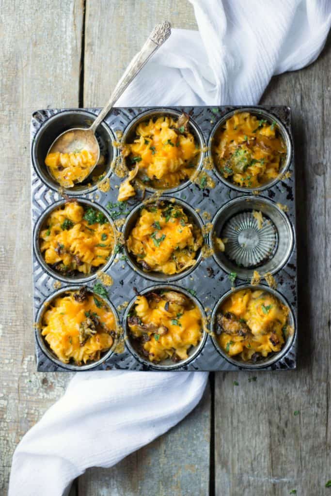 Overhead shot of mac and cheese cups in a tin