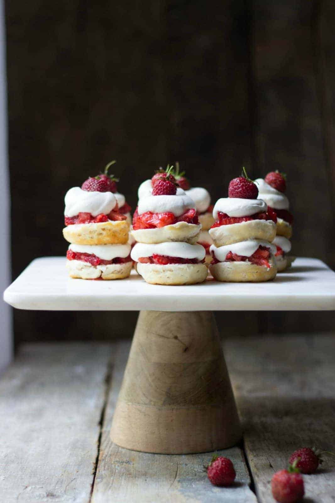 Mini strawberry shortcake stacks on a cake stand
