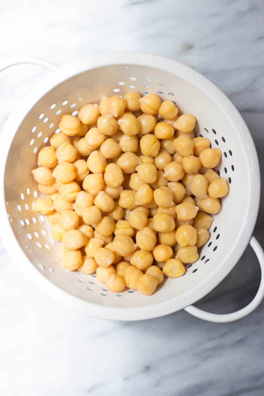 Chickpeas in a white strainer