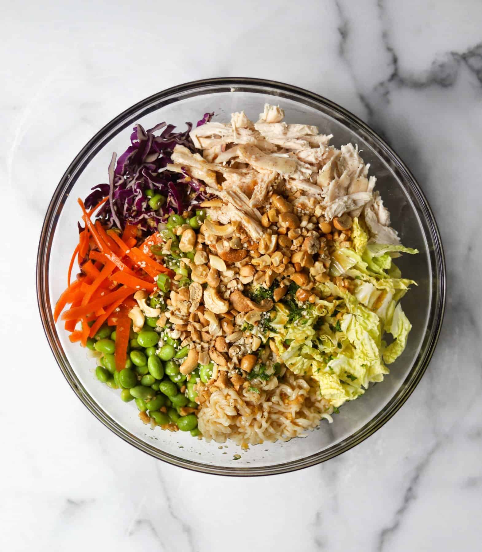 Chinese chicken salad in a clear bowl