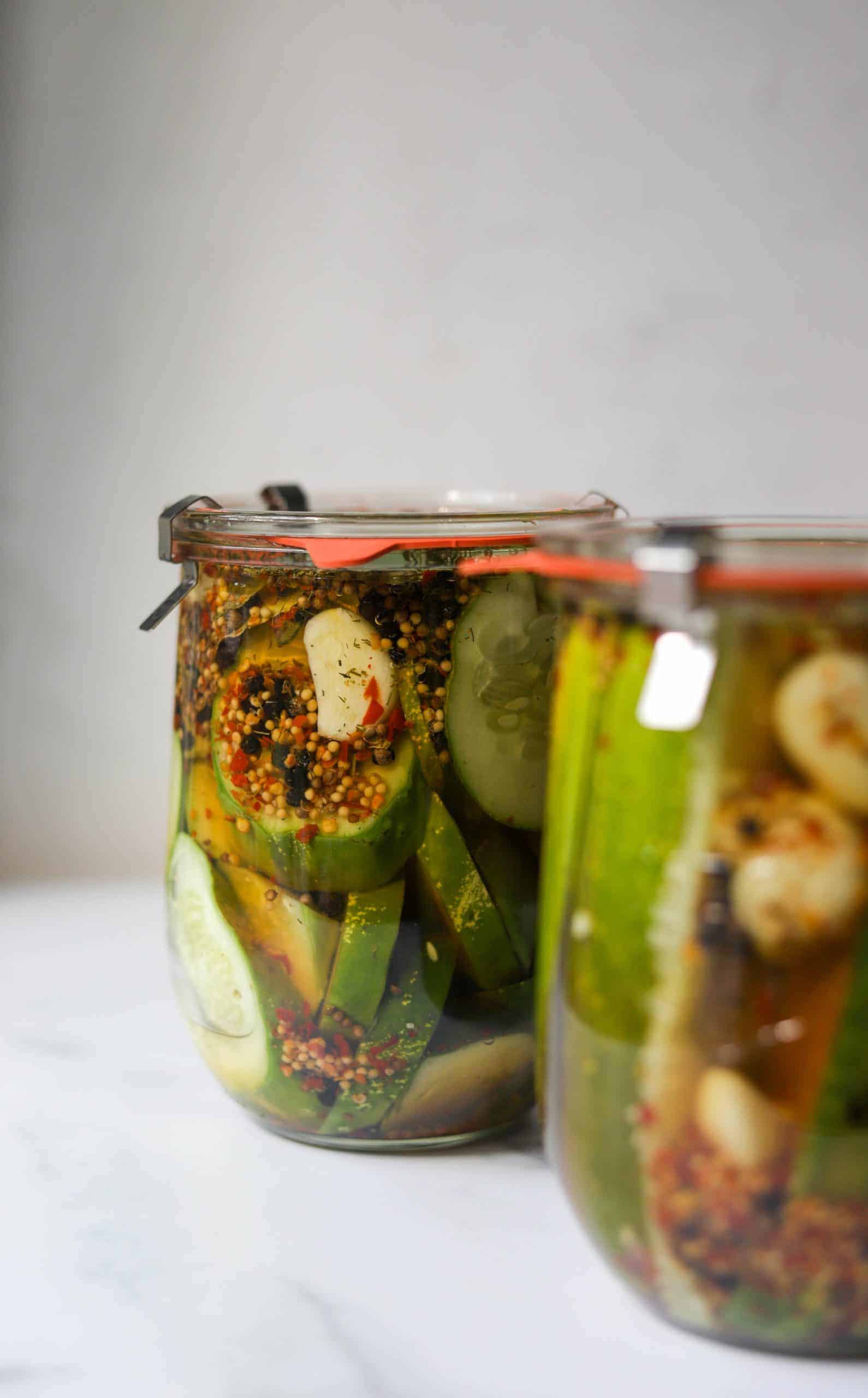 Close up shots of homemade pickles in jars.