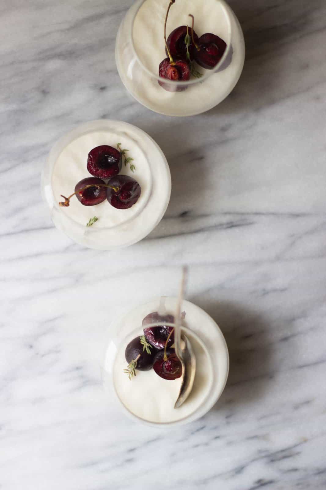 Overhead shot of a batch of coconut panna cotta in glass cups.