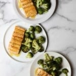 Maple roasted salmon and broccoli on 3 white plates