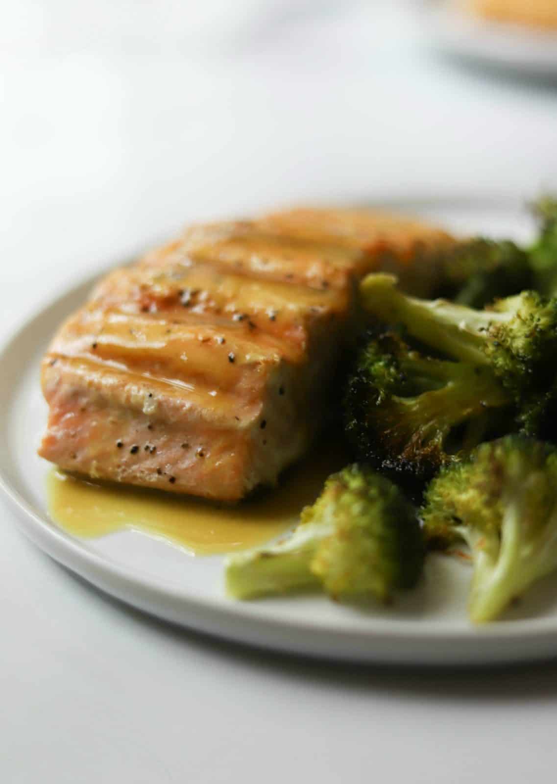Salmon and broccoli on a white plate