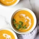 Three bowls of cauliflower coconut curry soup