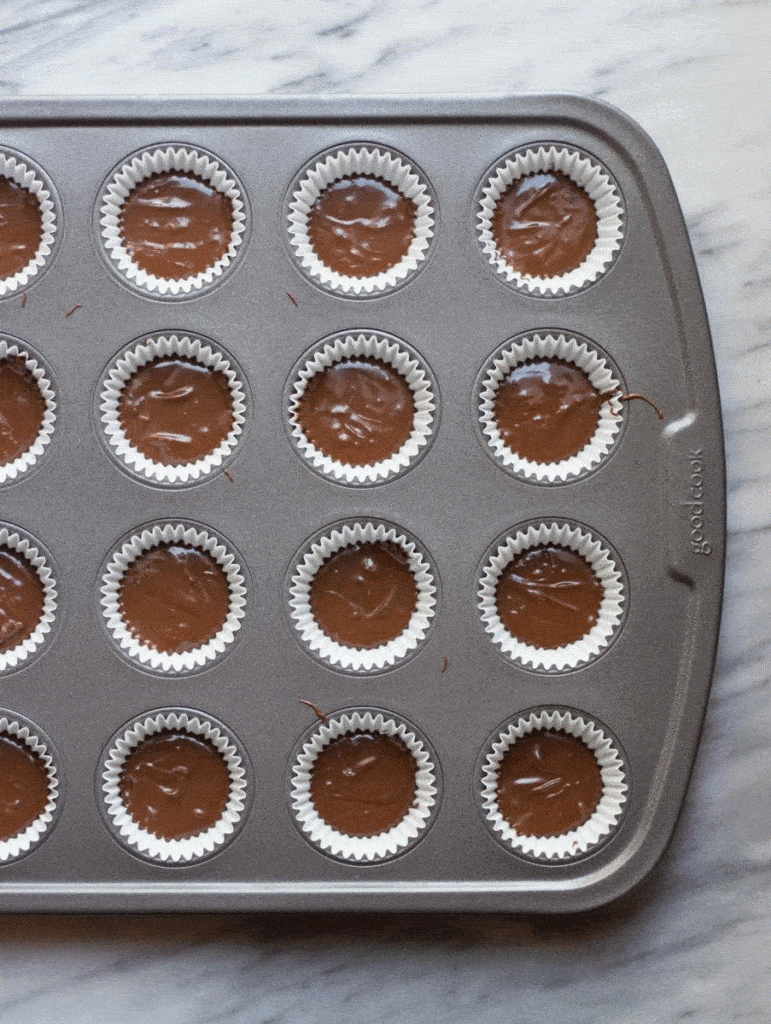 Mini Peanut Butter & Jelly Dark Chocolate Cups prior to being cooked in a metal pan. 