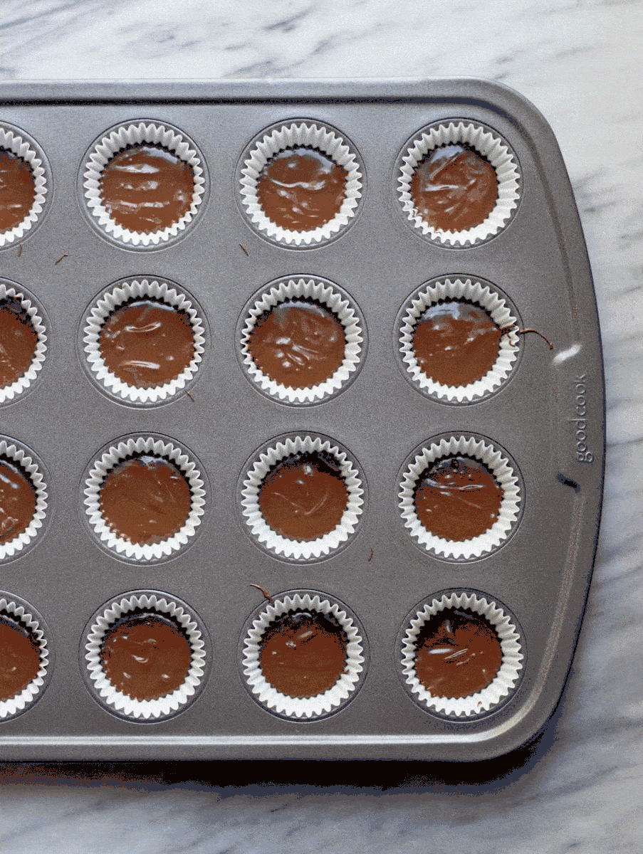 Mini Peanut Butter & Jelly Dark Chocolate Cups prior to being cooked in a metal pan. 