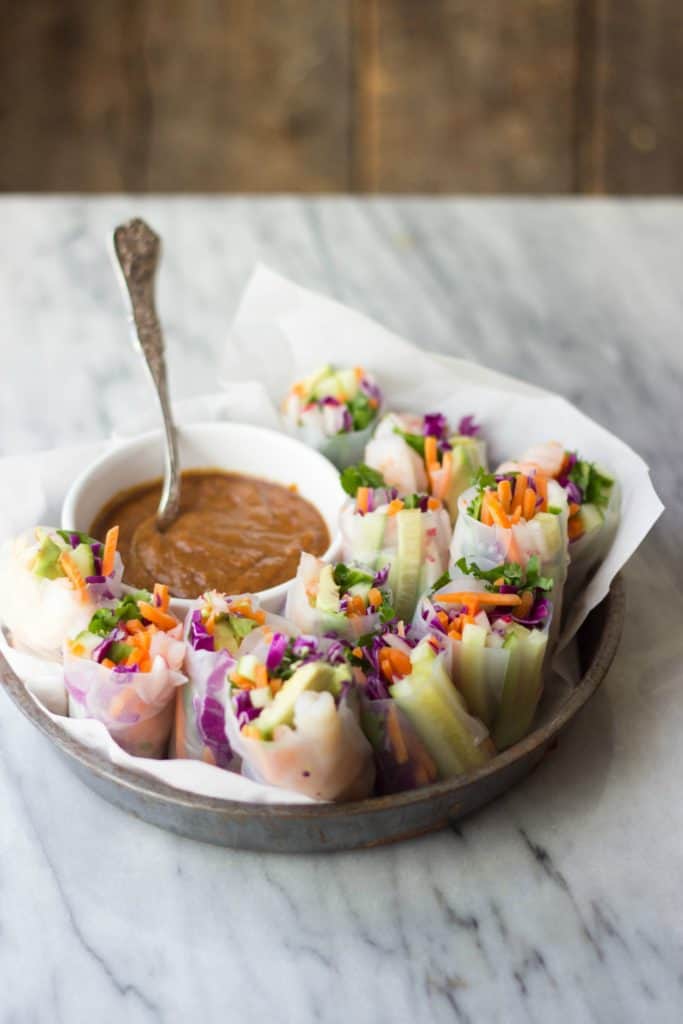 Side shot of finished Shrimp & Vegetable Spring Rolls with Ginger Peanut Sauce