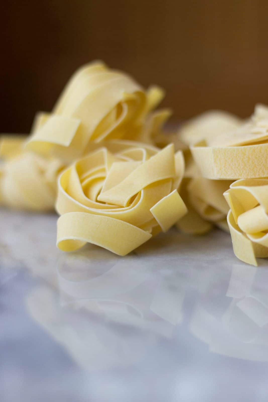 Close-up of Tagliatelle pasta prior to cooking.