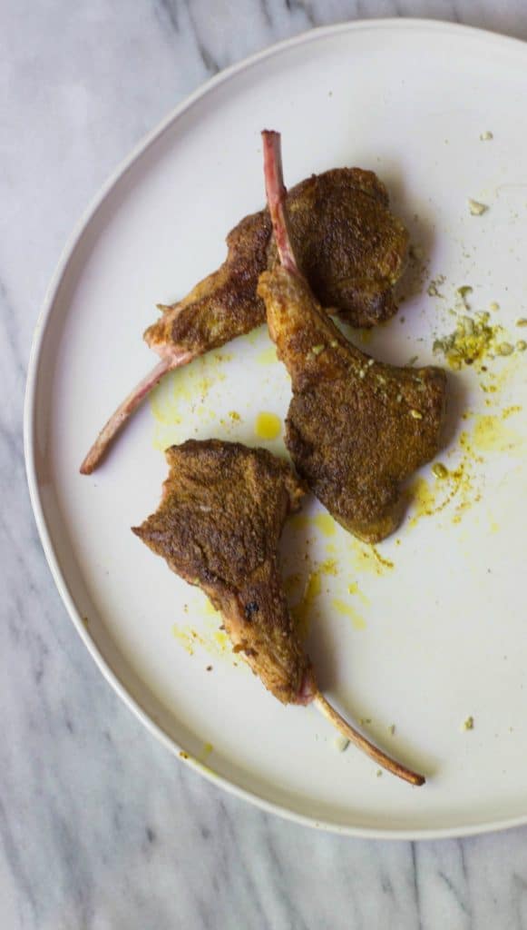 Moroccan Lamb Lollipops on a white plate. 