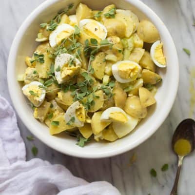 Simple Dijon Potato Salad in a white bowl.