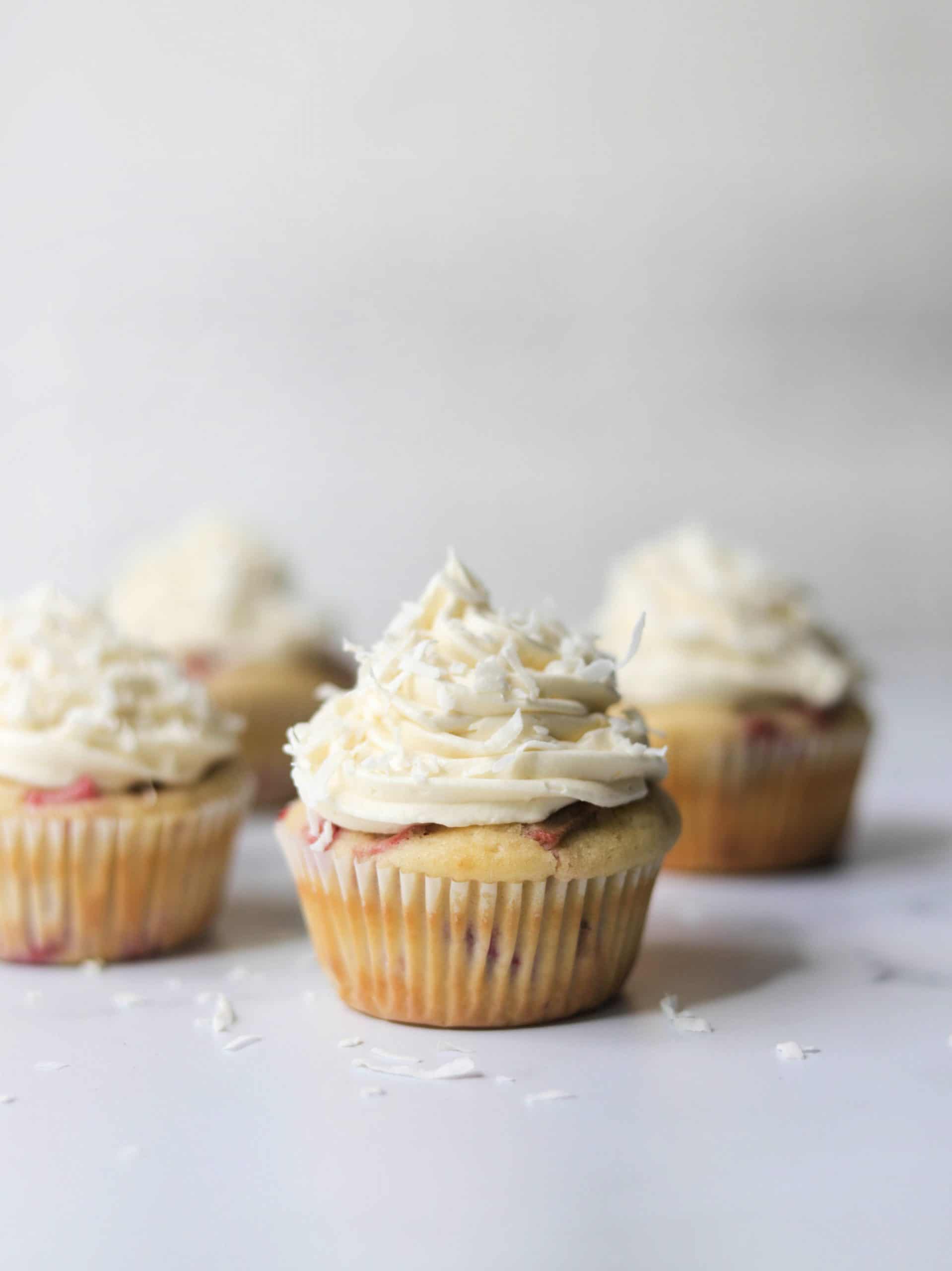 A side shot of astrawberry rhubarb cupcakes.