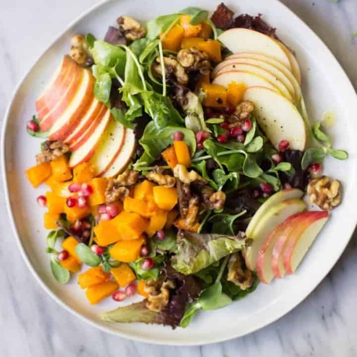 The Ultimate Autumn Salad on white plate.