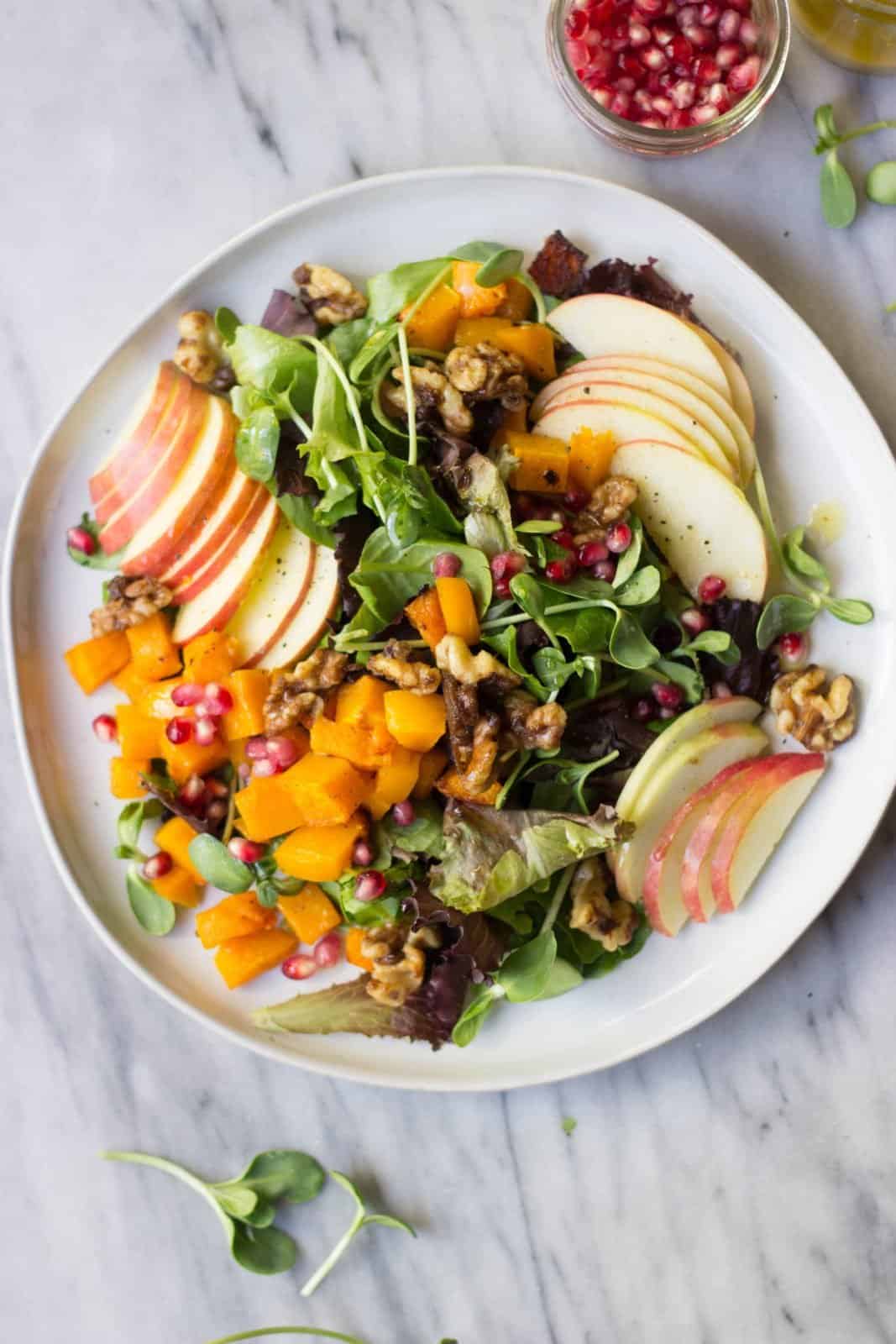 The Ultimate Autumn Salad on white plate.
