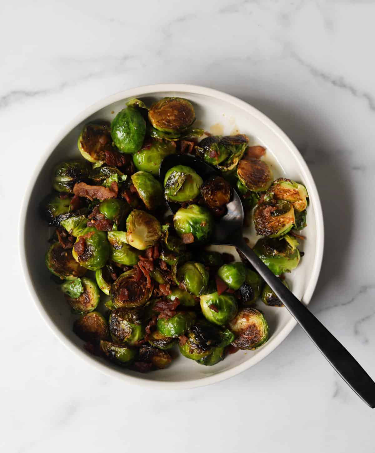 An overhead shot of a bowl of maple mustard brussels sprouts.