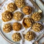 Pumpkin Muffins with Pistachio Crumble on tray.