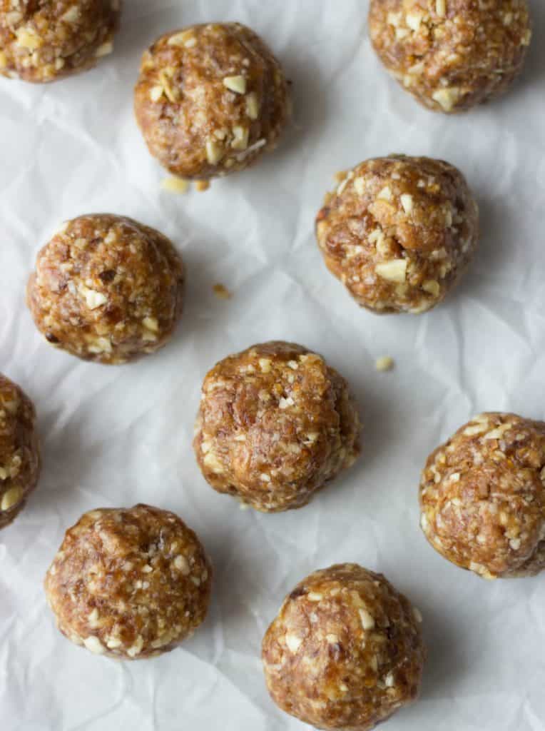 Overhead shot of coconut bites on parchment paper