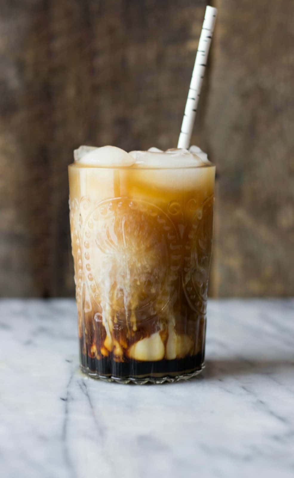 A side shot of an iced macchiato.