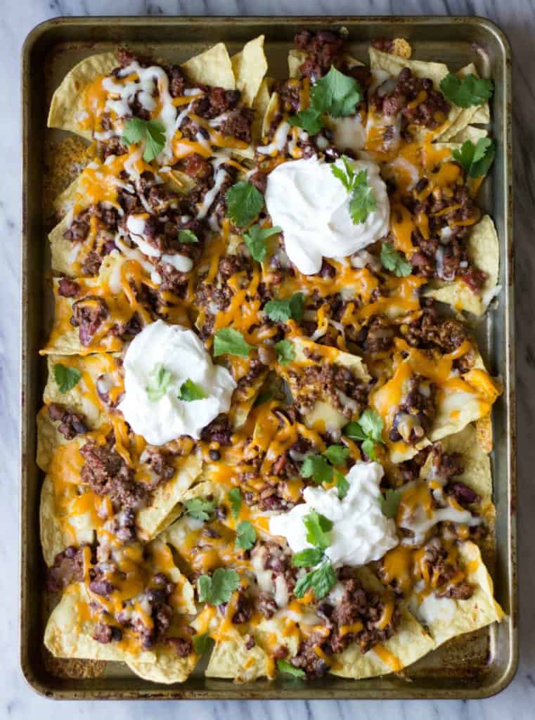 Overhead shot of Chili Nachos on a sheet pan