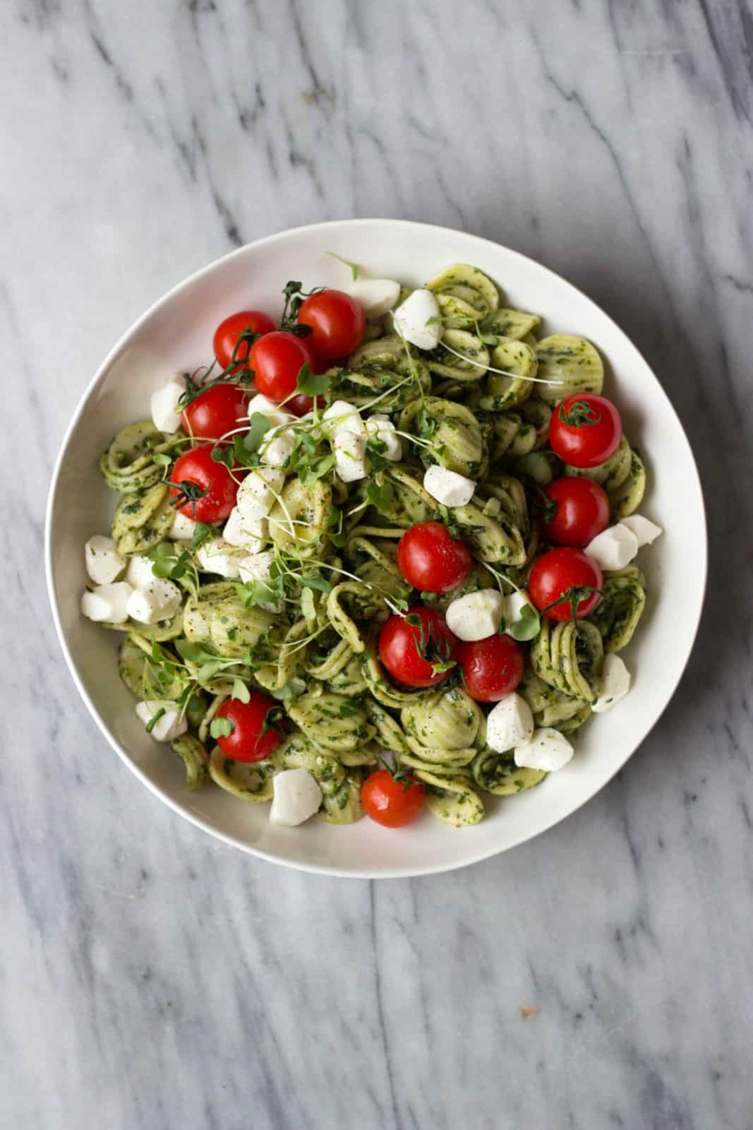 Caprese Pasta Salad in a white bowl (perfect for a healthy back-to-school idea)