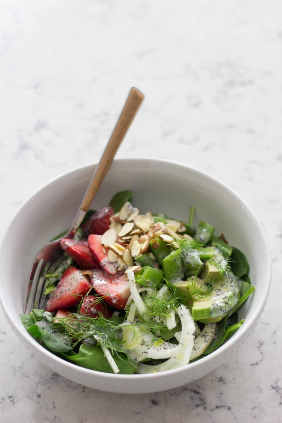 Bowl of spinach, strawberry & fennel salad 