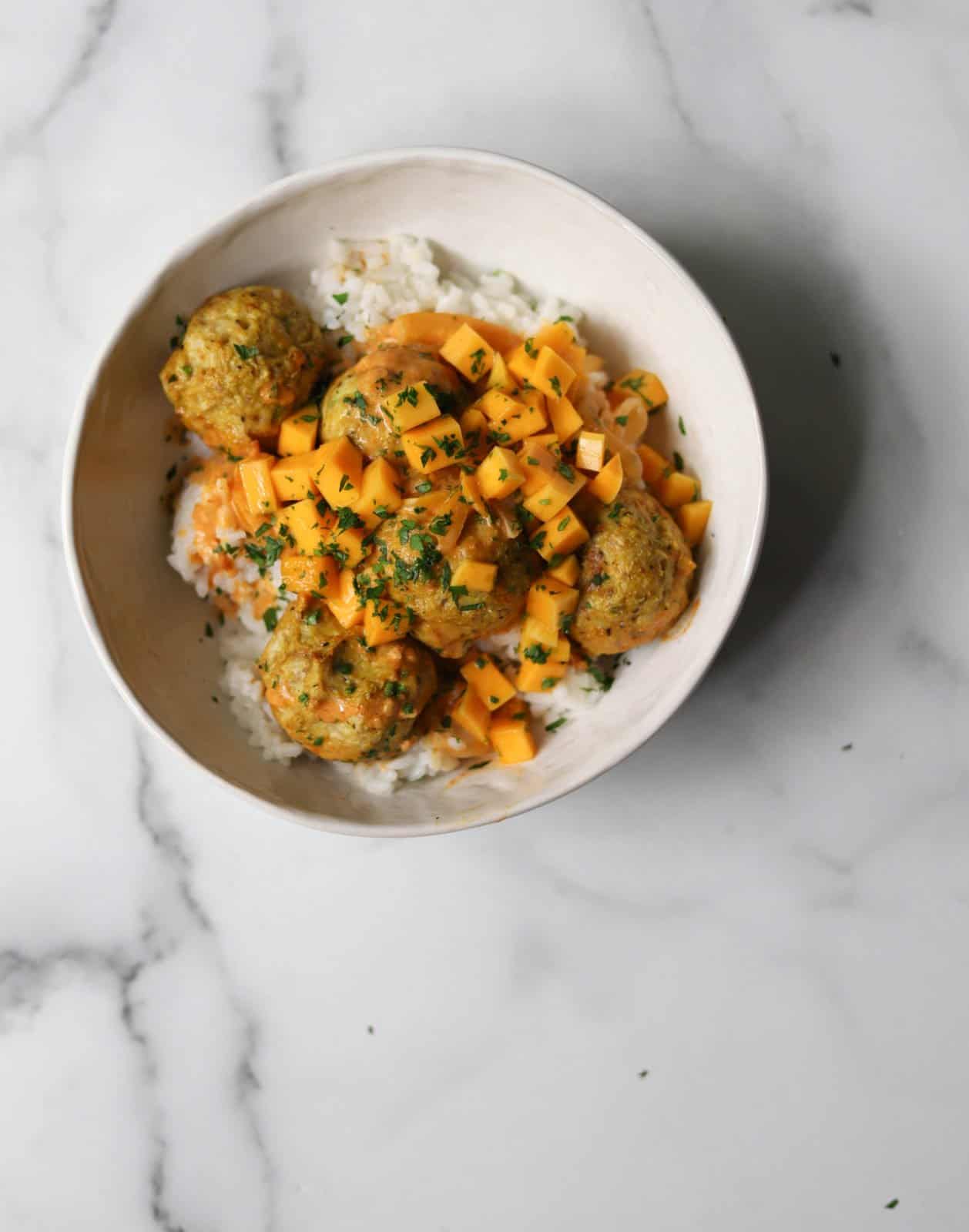 Overhead shot of one Curry Chicken Meatball Bowl