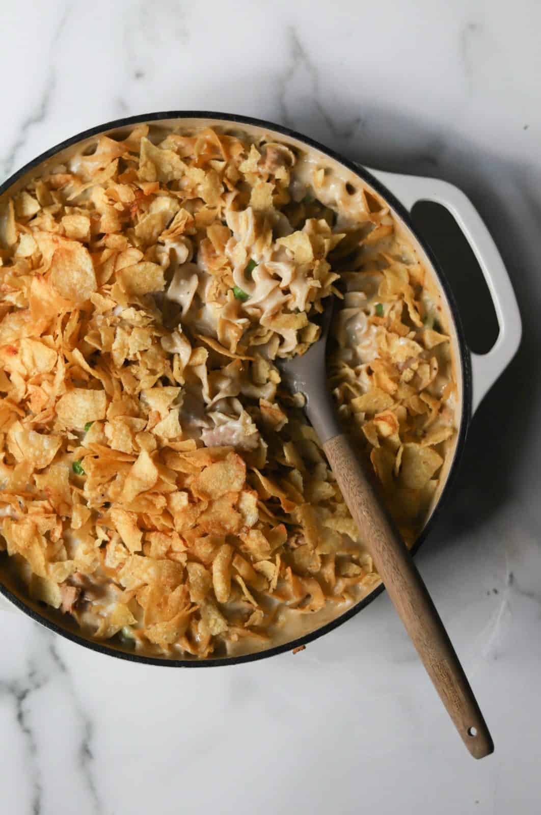 Overhead shot of Tuna Noodle Casserole in a white ceramic dutch oven