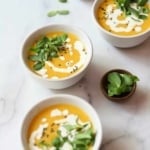 Butternut squash soup in white bowls