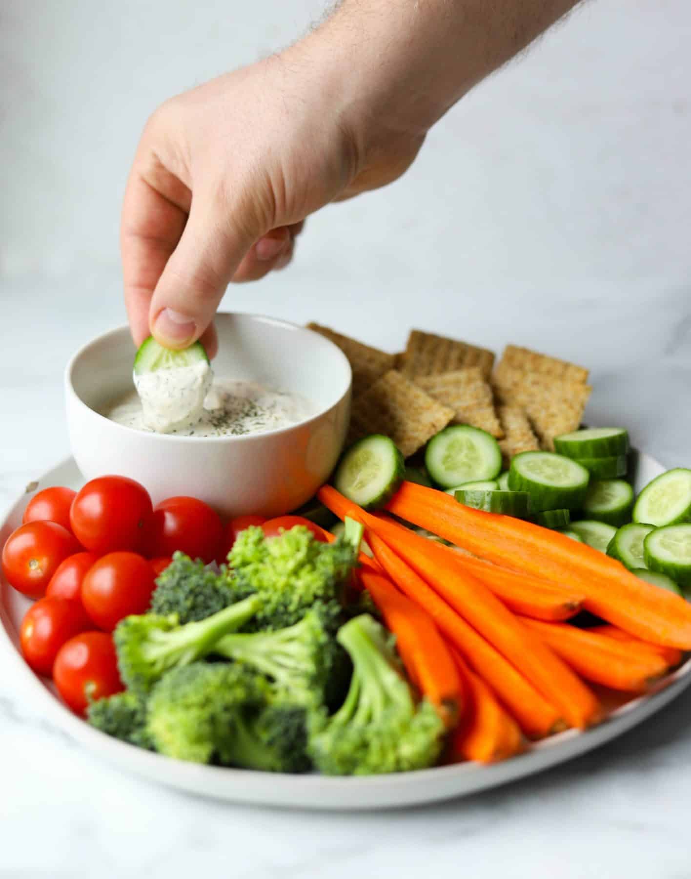 Veggie tray with hand dipping cucumber