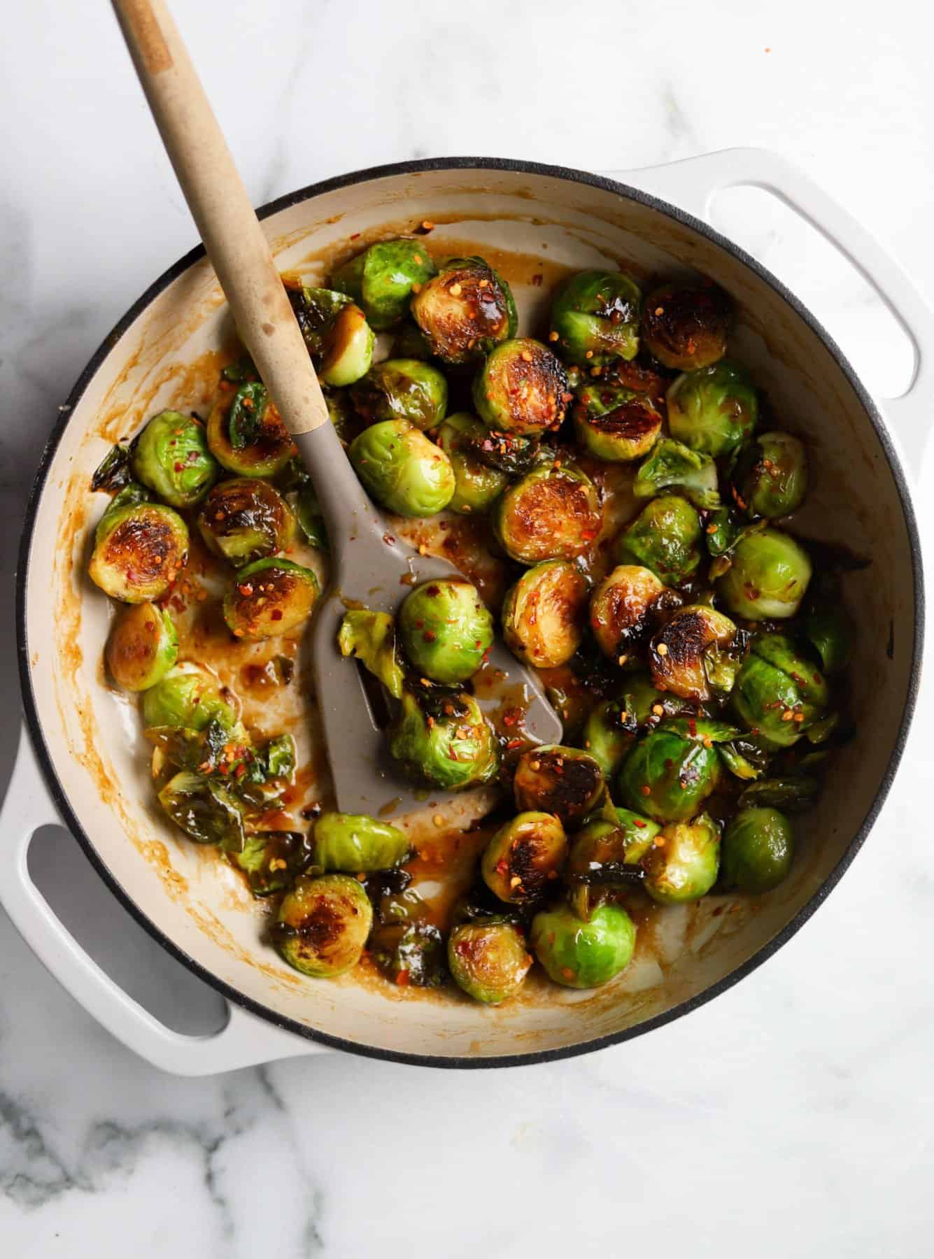 Kung Pao Brussels sprouts in white dish