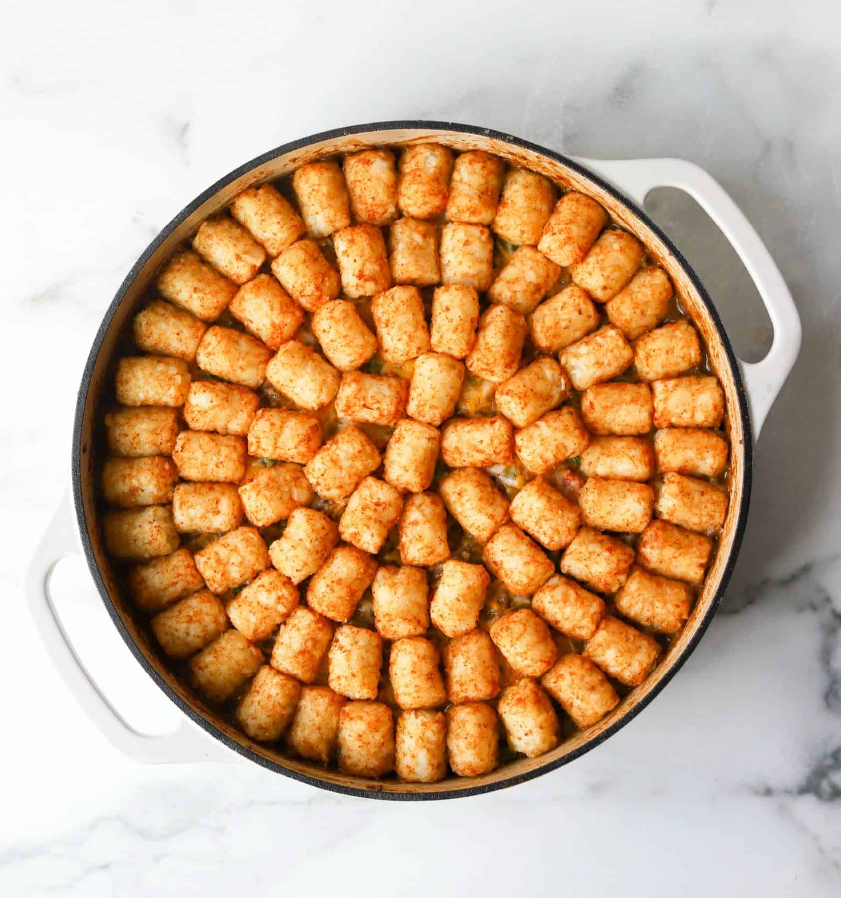 Tater tot casserole in white dish