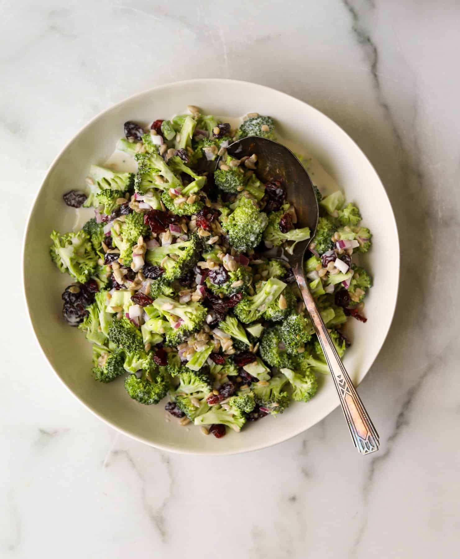 Broccoli salad in a white bowl