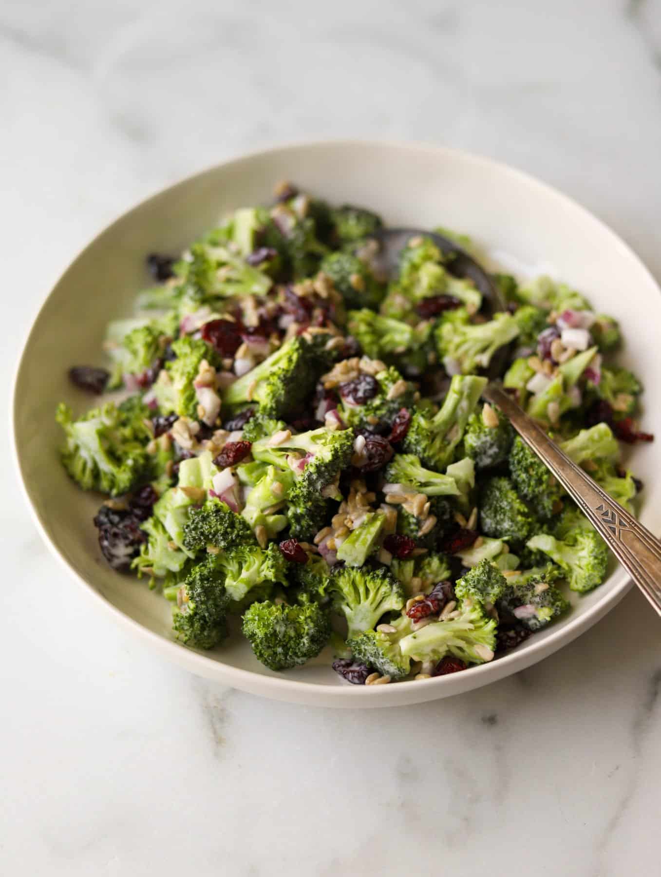 Broccoli salad in a white bowl