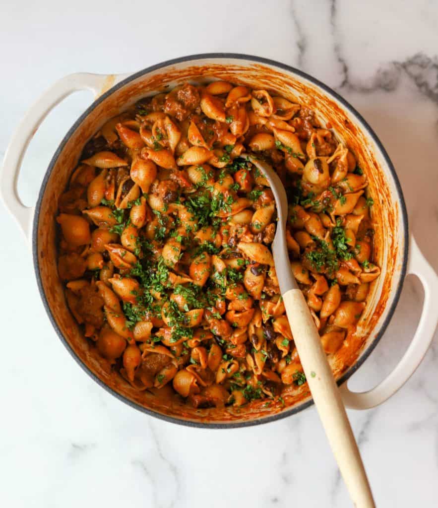 Cheesy taco pasta in a white Dutch oven