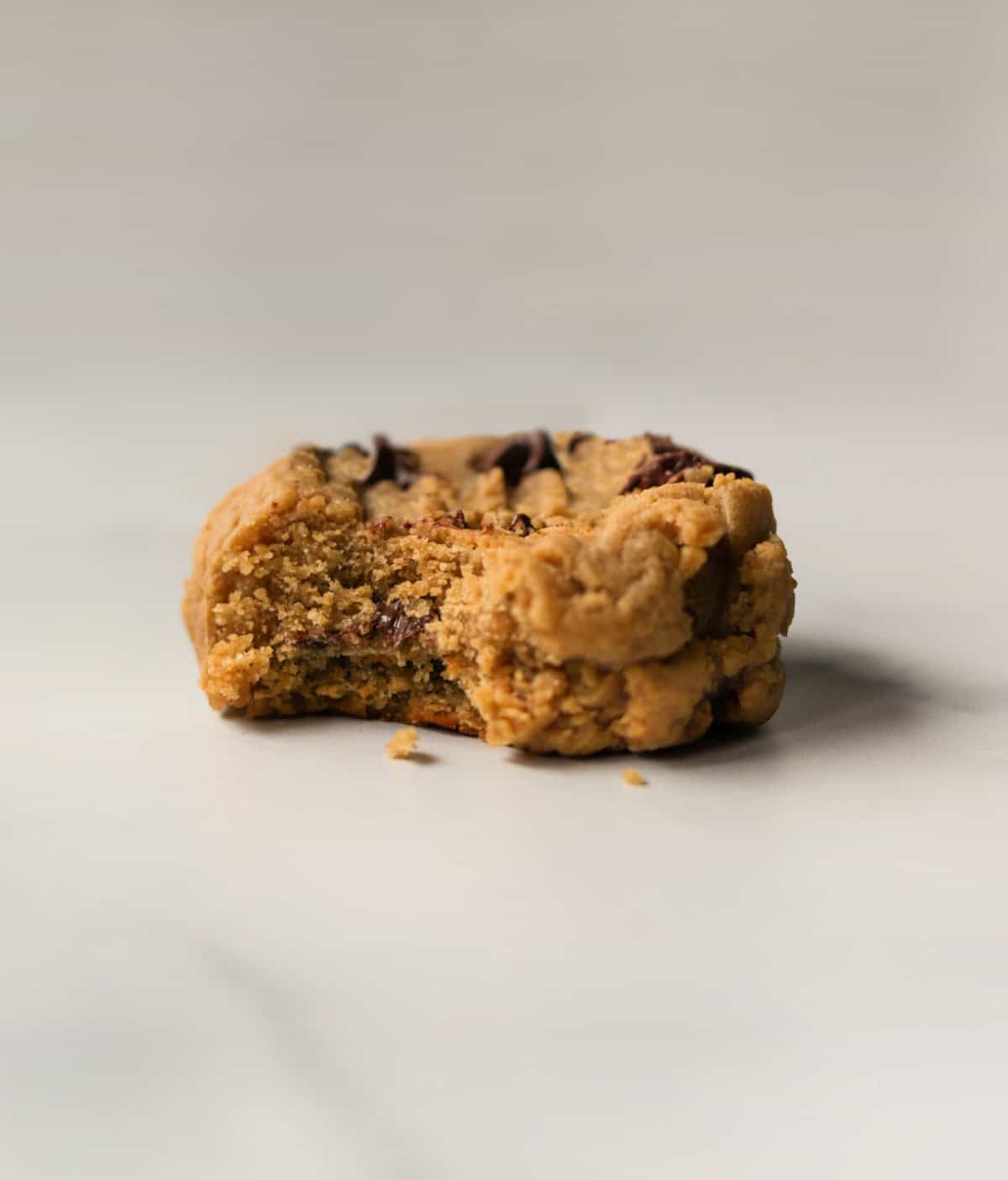 A front shot of a single peanut butter honey cookie.