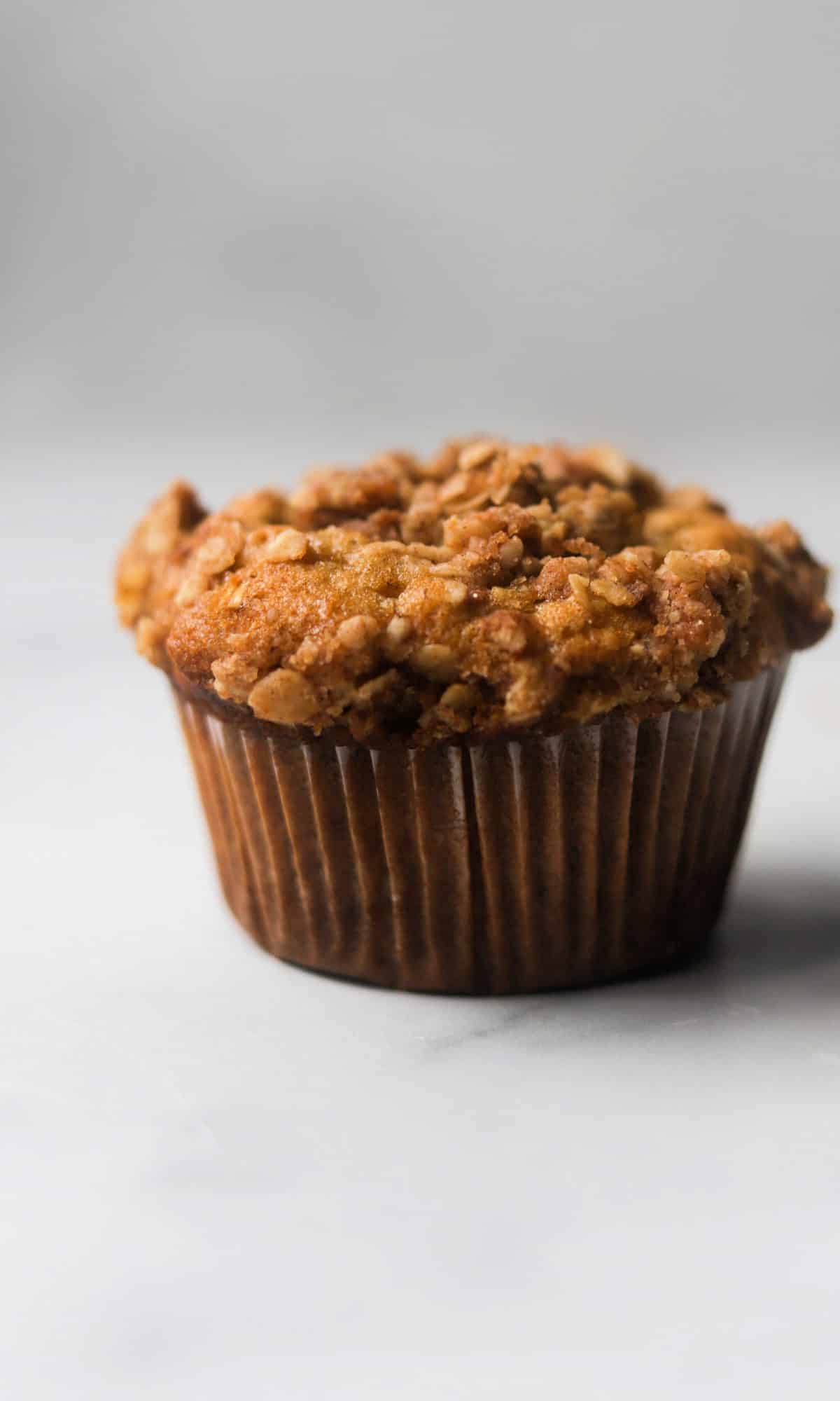 A side shot of a crumble muffin.