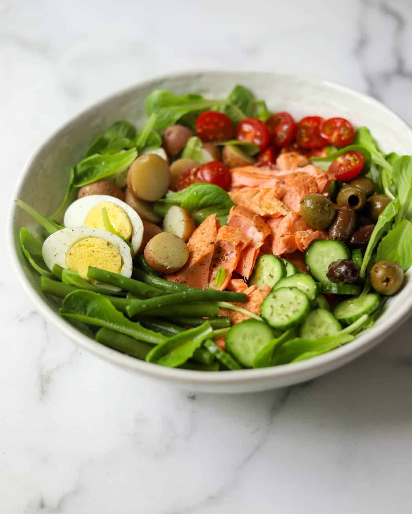 Salmon Nicoise Salad in a white bowl