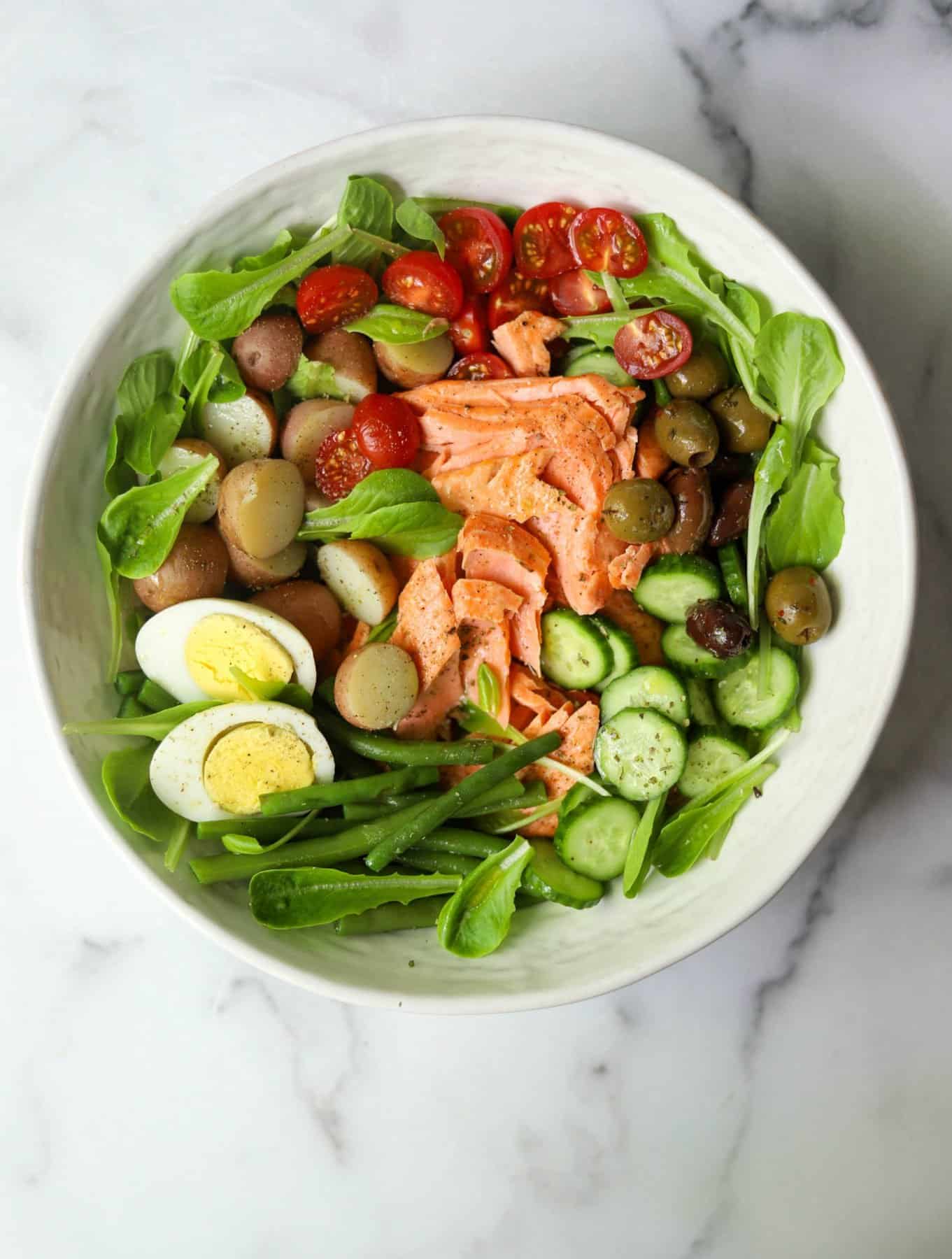 Salmon Nicoise Salad in a white bowl