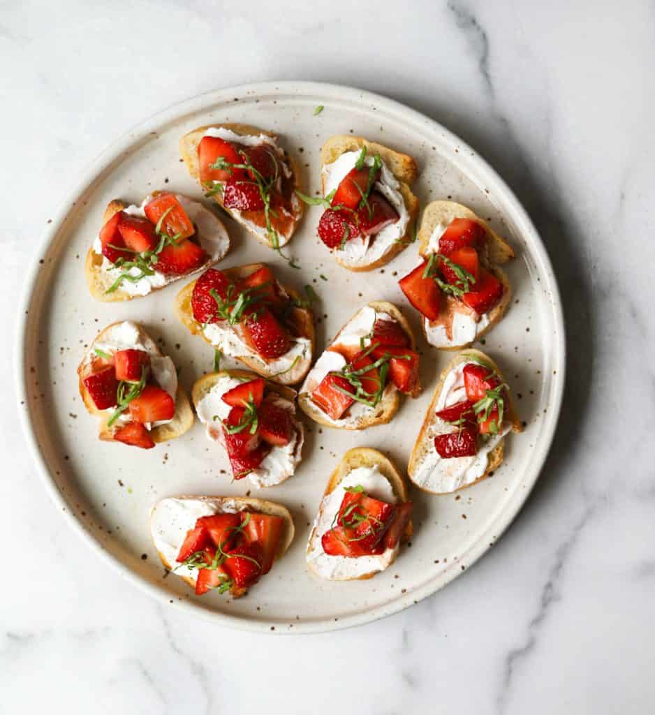 Strawberry basil bruschetta on a white plate