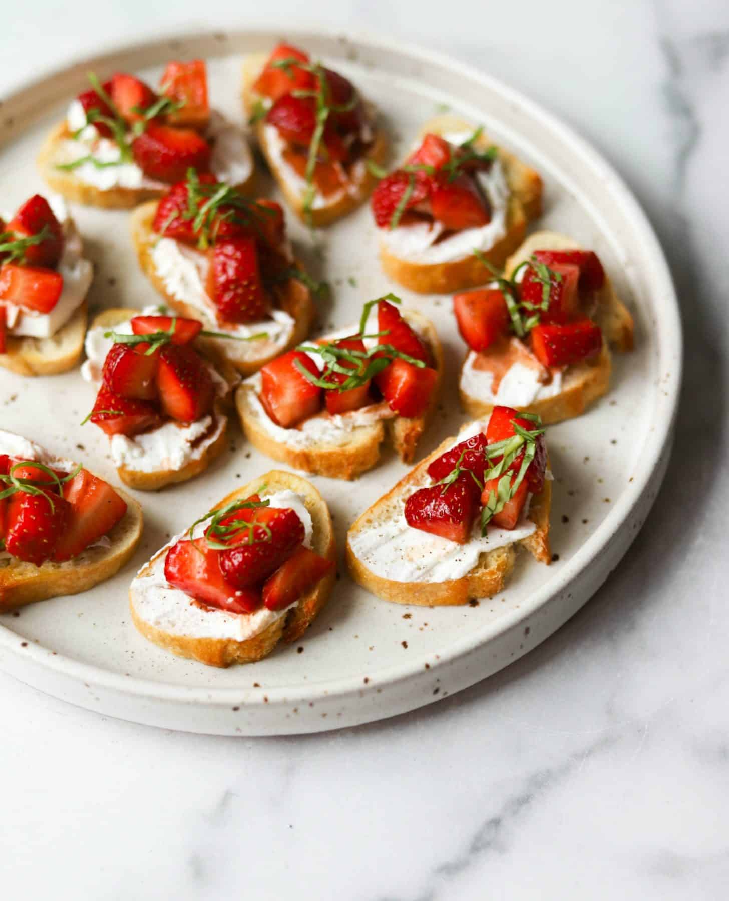 Strawberry basil bruschetta on a white plate